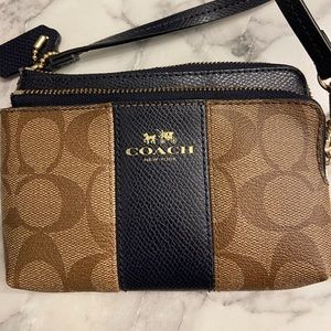 Coach tan and navy wristlet